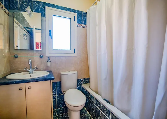 Kouloura Harbour View By *